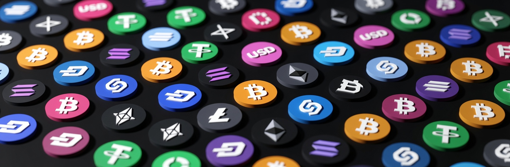 Assorted cryptocurrency token symbols arranged on a dark surface.